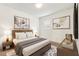 Bedroom featuring a queen bed, matching bedside tables, and warm neutral decor at 120 Citrus Isle St, Davenport, FL 33837