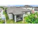 A cozy screened-in patio offers a tranquil retreat in this well-maintained backyard space at 120 Citrus Isle St, Davenport, FL 33837