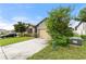 Charming single-story home with a two-car garage, lush landscaping and nice curb appeal at 120 Citrus Isle St, Davenport, FL 33837