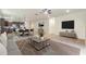 The open-concept floor plan offers a seamless flow between the kitchen, dining, and living spaces for modern living at 120 Citrus Isle St, Davenport, FL 33837