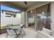 Screened in patio with an outdoor table and chairs, plus an upholstered lawn chair at 120 Citrus Isle St, Davenport, FL 33837