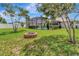 Spacious backyard with a fire pit and a screened-in pool at 1216 Cheshire St, Groveland, FL 34736
