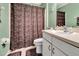 Bathroom featuring a combination shower and toilet at 1216 Cheshire St, Groveland, FL 34736