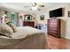Large bedroom with two dressers and a ceiling fan at 1216 Cheshire St, Groveland, FL 34736
