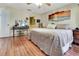 Bedroom with an ensuite bathroom and a view of a decorative wall art at 1216 Cheshire St, Groveland, FL 34736