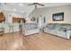 Open concept living room with seamless access to kitchen area, perfect for entertaining at 1216 Cheshire St, Groveland, FL 34736