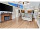 Comfortable living room with a fireplace and an open floor plan to the kitchen at 1216 Cheshire St, Groveland, FL 34736