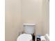 Standard height toilet with cleaning products and accessories at 1216 Cheshire St, Groveland, FL 34736