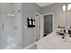 Elegant bathroom with a glass-enclosed shower, sleek vanity, and modern finishes at 13108 Serene Glade Rd, Winter Garden, FL 34787