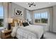 Bright main bedroom featuring stylish decor, neutral color palette, and ample natural light from large windows at 13108 Serene Glade Rd, Winter Garden, FL 34787