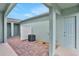 Enclosed patio area with brick pavers and exterior AC unit, great for outdoor relaxation at 13108 Serene Glade Rd, Winter Garden, FL 34787