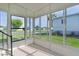 Bright sunroom with large windows, offering a clear view of the surrounding neighborhood at 1421 E Schwartz Blvd, The Villages, FL 32159
