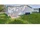 Detached one-car garage situated on a well-maintained lawn with an adjacent A/C unit at 1421 E Schwartz Blvd, The Villages, FL 32159