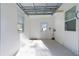 Clean, freshly painted garage with epoxy floors, natural light, and overhead door mechanics at 1421 E Schwartz Blvd, The Villages, FL 32159
