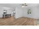 Open-concept living and dining area with hardwood flooring and natural light at 1421 E Schwartz Blvd, The Villages, FL 32159