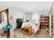 Comfortable bedroom with ample natural light, a cozy bed and decorative furniture at 149 Shiloh Ave, Lady Lake, FL 32159