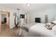 Cozy bedroom featuring blue walls, stylish decor, and a comfortable-looking bed at 149 Shiloh Ave, Lady Lake, FL 32159