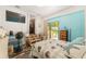 Bedroom featuring wood floors, and aqua paneling at 149 Shiloh Ave, Lady Lake, FL 32159