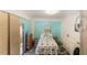 Bedroom featuring wood floors, and aqua paneling at 149 Shiloh Ave, Lady Lake, FL 32159
