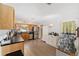 Bright kitchen features modern appliances, wooden cabinets, and a view of the additional storage at 149 Shiloh Ave, Lady Lake, FL 32159