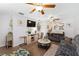 Cozy living room with comfortable seating, wood-look floors, and a bright, open layout at 149 Shiloh Ave, Lady Lake, FL 32159