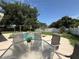 Backyard pool with lounge area and privacy fence on a sunny day at 15349 Lafite Ln, Clermont, FL 34714