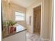 Bathroom featuring a vanity with a granite countertop, window, and walk-in shower at 15349 Lafite Ln, Clermont, FL 34714