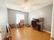 Bright bedroom with laminate floors, ceiling fan, and natural light at 15349 Lafite Ln, Clermont, FL 34714