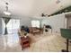 Cozy living room featuring a sliding glass door for natural light and an open floor plan at 15349 Lafite Ln, Clermont, FL 34714