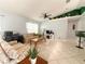 Cozy living room with an open concept, featuring a ceiling fan and lots of natural light at 15349 Lafite Ln, Clermont, FL 34714