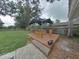 Private backyard oasis featuring a wooden deck with a hot tub under a gazebo, perfect for relaxing outdoors at 1610 Williams Ave, Eustis, FL 32726