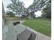 Outdoor patio area with stone pavers and a large backyard, perfect for entertaining or relaxing at 1610 Williams Ave, Eustis, FL 32726