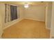 Spacious bedroom with tile flooring, a ceiling fan, and a closet for ample storage at 1610 Williams Ave, Eustis, FL 32726