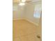 Bright bedroom with tile flooring, a ceiling fan, and a closet for ample storage at 1610 Williams Ave, Eustis, FL 32726