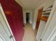 Bright foyer with tile flooring and a view into the hallway leading to other rooms at 1610 Williams Ave, Eustis, FL 32726