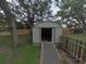 Backyard storage shed with a walkway, ideal for storing your tools and equipment at 1610 Williams Ave, Eustis, FL 32726