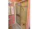 Bathroom featuring a glass-enclosed shower and neutral wall paneling at 163 Sweet Cir, Winter Haven, FL 33884