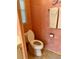 Well-maintained bathroom with a standard toilet, light fixtures, and convenient layout at 163 Sweet Cir, Winter Haven, FL 33884
