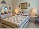 Comfortable bedroom featuring a beautifully made bed, dresser, and vanity, creating a welcoming atmosphere at 163 Sweet Cir, Winter Haven, FL 33884