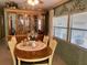 Cozy dining room with wood table, chairs, built-in hutch, and ample natural light at 163 Sweet Cir, Winter Haven, FL 33884