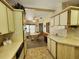Efficient kitchen design with ample storage cabinets and a seamless flow to the dining area at 163 Sweet Cir, Winter Haven, FL 33884