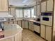 Cozy kitchen with appliances and upper and lower wood cabinets at 163 Sweet Cir, Winter Haven, FL 33884