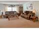 Inviting living room featuring plush seating, a decorative display cabinet, and a bright, airy ambiance at 163 Sweet Cir, Winter Haven, FL 33884