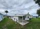 Features a well-maintained yard, utility connections, and an aluminum roof in a quiet residential community at 163 Sweet Cir, Winter Haven, FL 33884