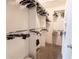 Organized walk-in closet with ample storage and shelving for clothes and accessories at 1654 Blossom Ter, The Villages, FL 32162