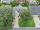 Aerial view of property and yard showcasing mature trees and landscaping at 1889 Union Pl, The Villages, FL 32162