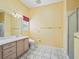 Bathroom featuring tile floor, vanity and walk-in shower at 1889 Union Pl, The Villages, FL 32162