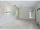 Spacious bedroom featuring carpet, ceiling fan, and light-colored walls at 1889 Union Pl, The Villages, FL 32162