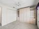 Bedroom features a built-in wardrobe, wall closet, ceiling fan, and carpeting at 1889 Union Pl, The Villages, FL 32162