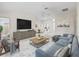 Decorated living room featuring neutral color palettes and a comfortable sitting area at 1889 Union Pl, The Villages, FL 32162